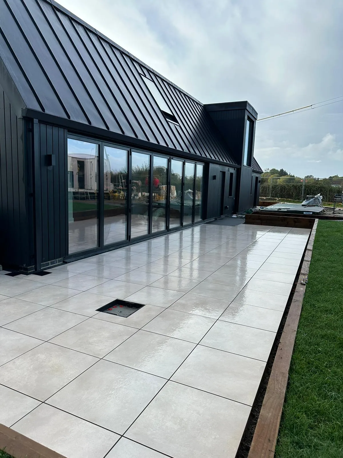 black building with new paving area
