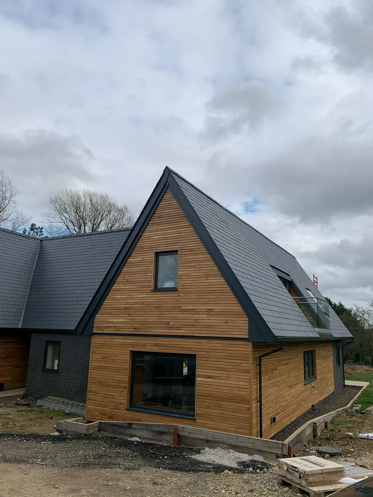 a wooden house with a metal roof